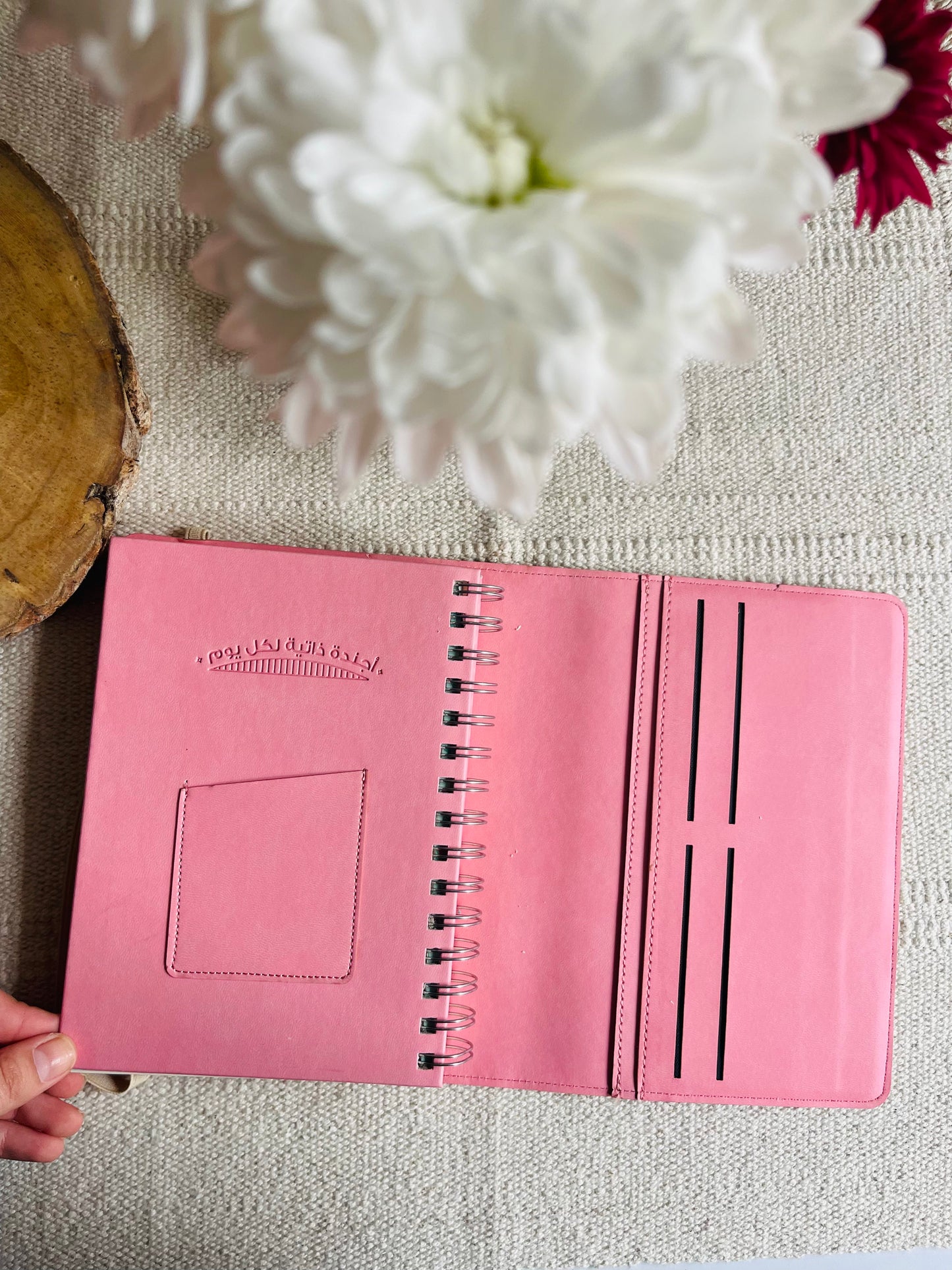 Leather spiral-bound agenda in Arabic.